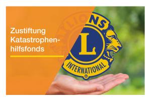 Eine Hand die unter einem Lions-Logo schwebt