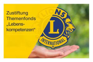 Eine ausgestreckte Hand unter einem Lions Logo